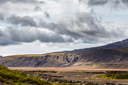 View on a huge mountain in Iceland with dramatic skyの写真素材
