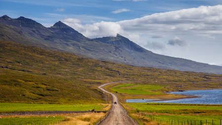 Road on a east of Iceland on mount background at sunny dayの写真素材