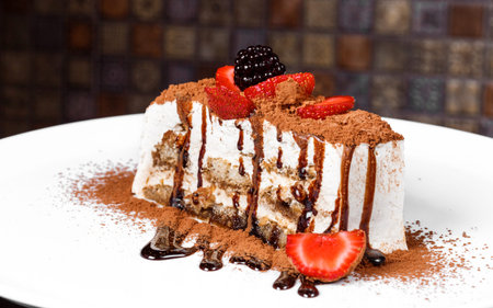 tiramisu on a plate decorated with chocolate