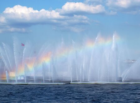 Rainbow between the sky and waterの写真素材