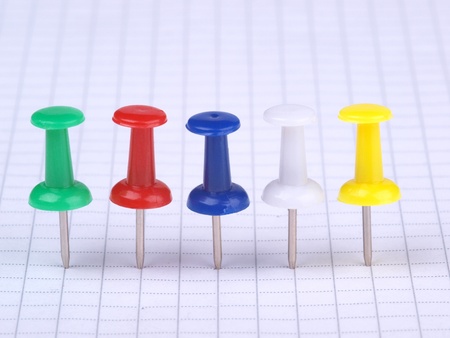 Color photograph of color buttons and a sheet of paper      の写真素材