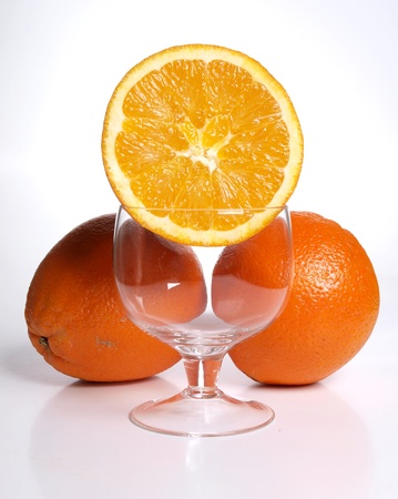 Color photograph of glass tumblers and oranges      の写真素材