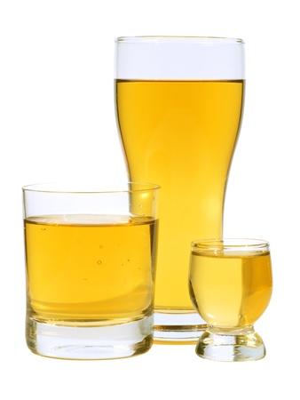 Color photograph of three glass wine glasses with grape juice on a white background       の写真素材