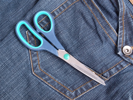Color photo of tailoring scissors to denim       の写真素材
