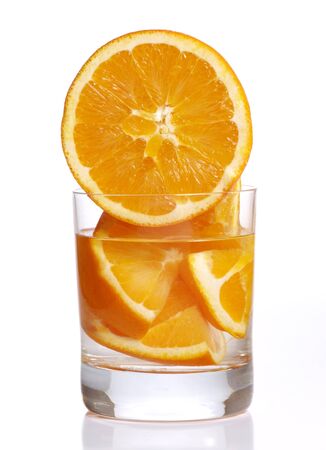 Color photograph of glass tumblers and oranges     の写真素材