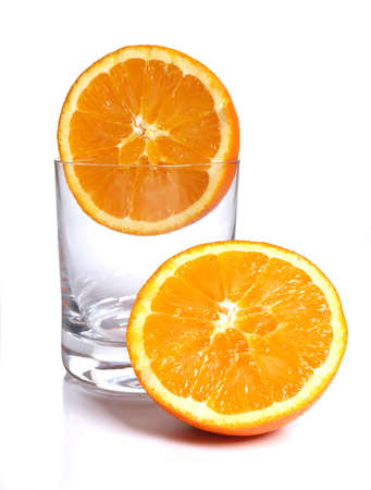 Color photograph of glass tumblers and oranges       の写真素材