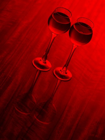 Color photo of a glass of red wine glasses on wood surface        の写真素材