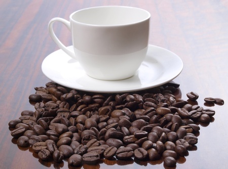 Color photo of coffee beans and a white cup       の写真素材