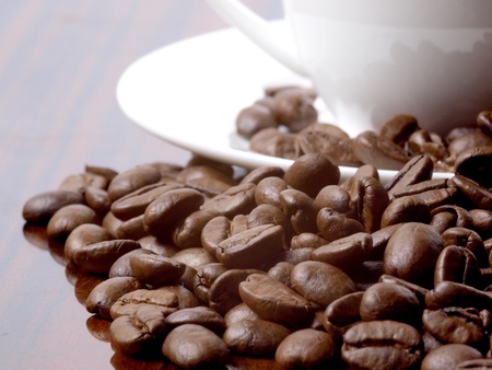Color photo of coffee beans and a white cup       の写真素材
