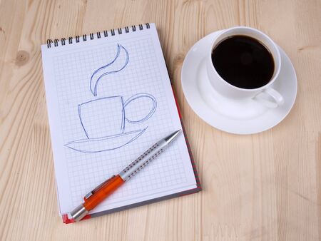 Color photo of paper page and a white cup        の写真素材