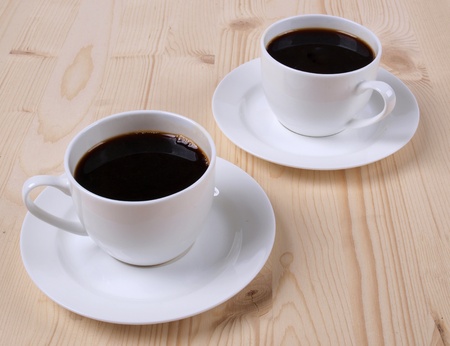Color photo of white coffee cup on wood     の写真素材