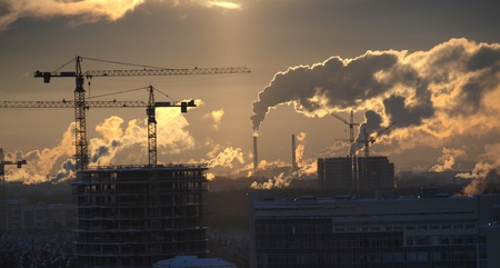 Color photograph of construction cranes on skyline    の写真素材