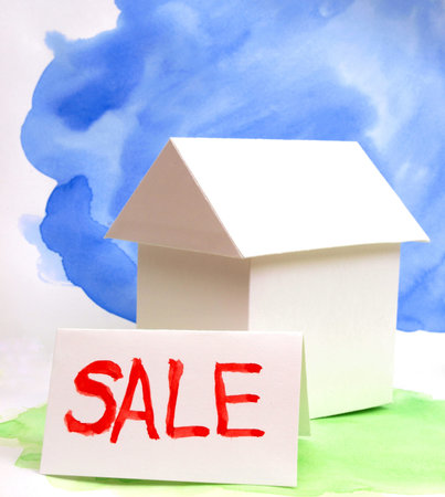 Color photo paper model house on a colored background       の写真素材