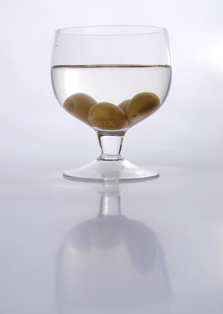 Color photo of green olives in a glass     の写真素材