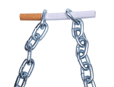 Color photo of a cigarette and a metal chain        の写真素材