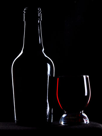 bottles and glasses on a black background       の写真素材