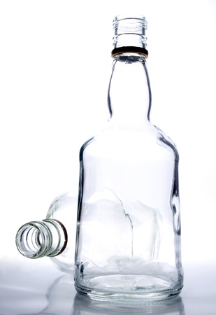 Photo bottles and glasses on a white background        の写真素材