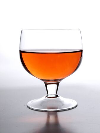 Color photo of brandy glasses on mirror surface     の写真素材
