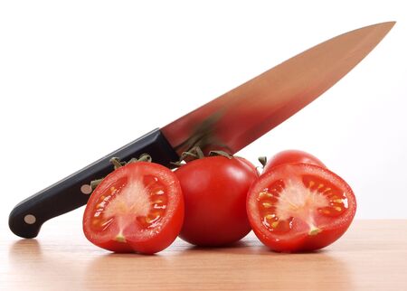 a kitchen knife and tomato       の写真素材