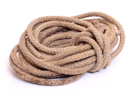 Color photo of a coil of rope on a white backgroundの写真素材