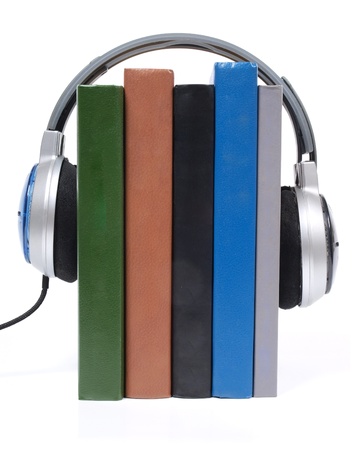 Color photo of a stack of books and headphones        の写真素材