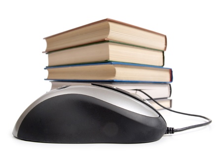 Color photo of an stack books and mouse        の写真素材