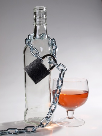 Color photo of bottles of whiskey and metal chain     の写真素材