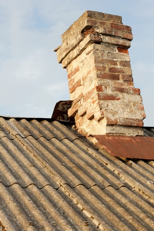  brick chimney on roofの写真素材