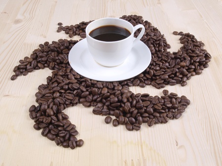 Color photo of coffee beans and a white cup       の写真素材