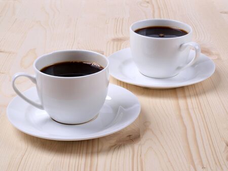 Color photo of white coffee cup on wood    の写真素材