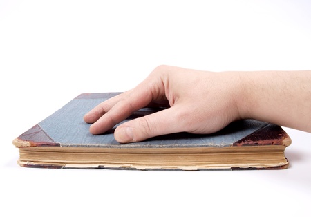 Color photo of an old book and hands       の写真素材