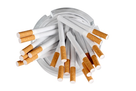 Color photo of a glass ashtray and cigaretteの写真素材