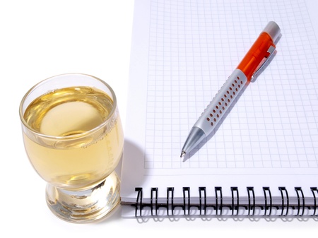 Color photo of glasses cup and empty notebook      の写真素材