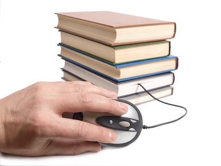 Color photo of an stack books and mouse       の写真素材