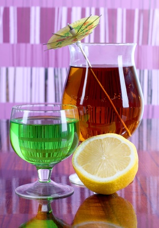 a glass cup with a cocktail and lemonの写真素材