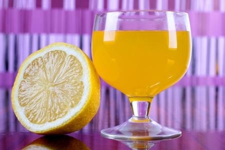 a glass cup with a cocktail and lemonの写真素材