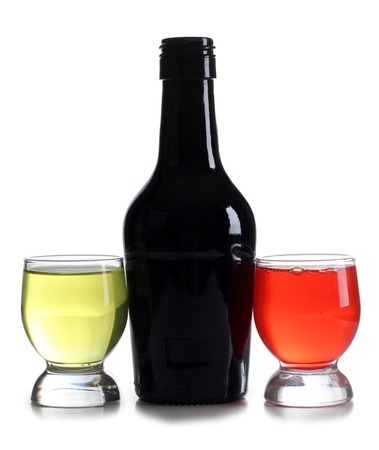 Color photograph of bottle and cocktails in glass beakersの写真素材