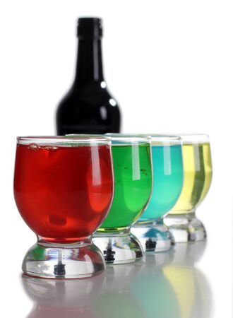 Color photograph of bottle and cocktails in glass beakersの写真素材