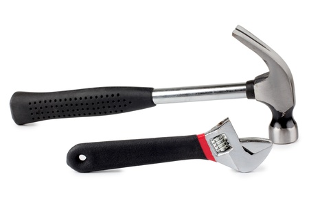 Color photo of a metal wrench and hammerの写真素材