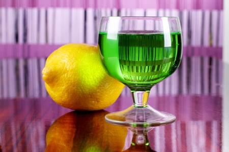 Color photo of a glass cup with a cocktail and lemonの写真素材