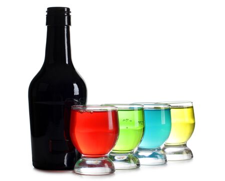 Color photograph of bottle and cocktails in glass beakersの写真素材