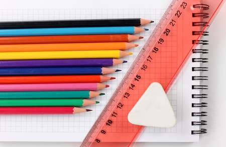 Color photo of a set of pencils on notepadの写真素材
