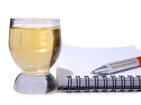 Color photo of glasses cup and empty notebook      の写真素材