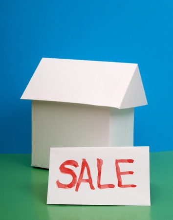 Color photo paper model house on a colored background       の写真素材