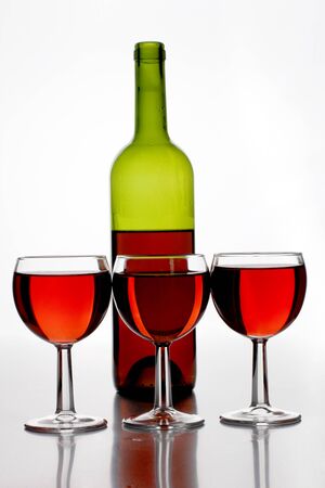 Color photograph of cocktails in glass beakers and bottleの写真素材
