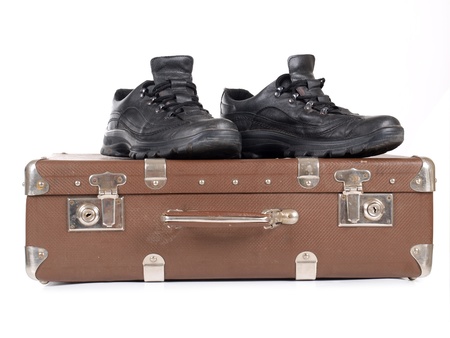 Color photo of an old suitcase and men's shoes       の写真素材