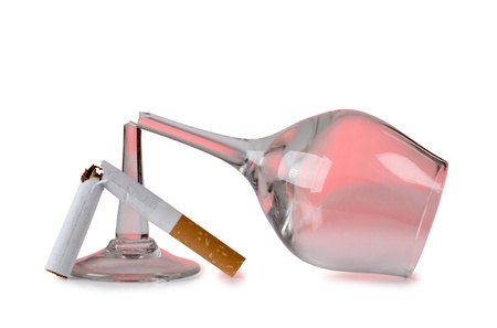 Color photo of broken cigarette and glassesの写真素材