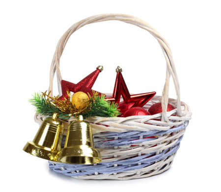 Color photo of bells in wooden wicker basketの写真素材