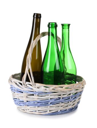 Color photo of a bottle in wooden wicker basketの写真素材