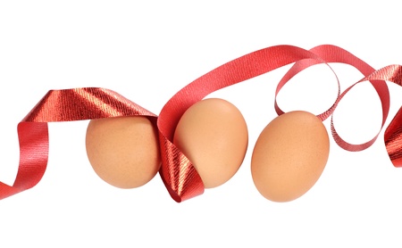 Color photo of eggs and red bowの写真素材